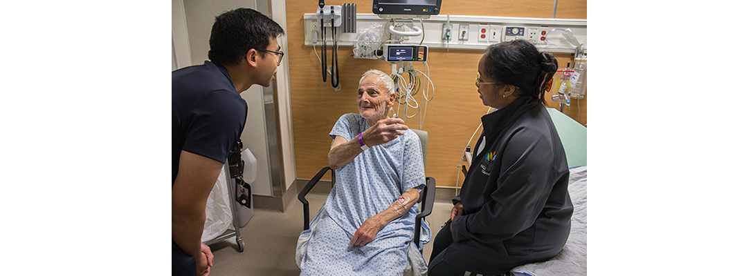 In the Emergency Department, Nicola Marzelli, 92, discusses his medical condition with Geriatrician Dr. Wayne Lok and Geriatric Nurse Felecia Armstrong, members of the department’s Geriatric Inter-disciplinary Team.